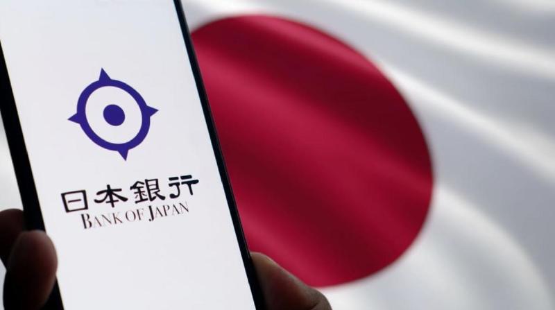 Logo Bank of Japan dengan latar belakang bendera Jepang